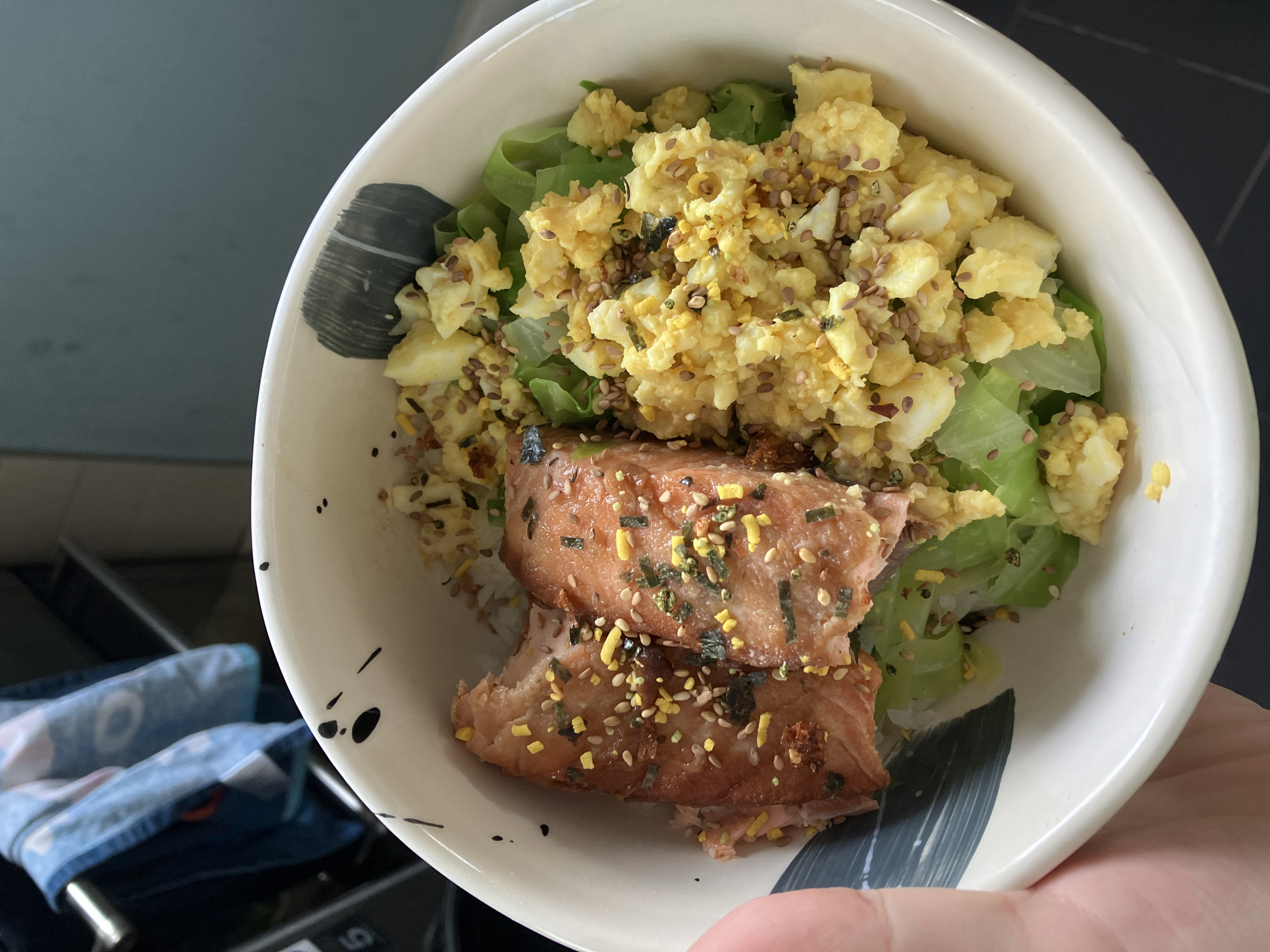 a similar rice bowl, except this time there are hard boiled egg pieces on top of the cabbage, and furikake sprinkled on top a similar rice bowl, except this time there are hard boiled egg pieces on top of the cabbage, and furikake sprinkled on top